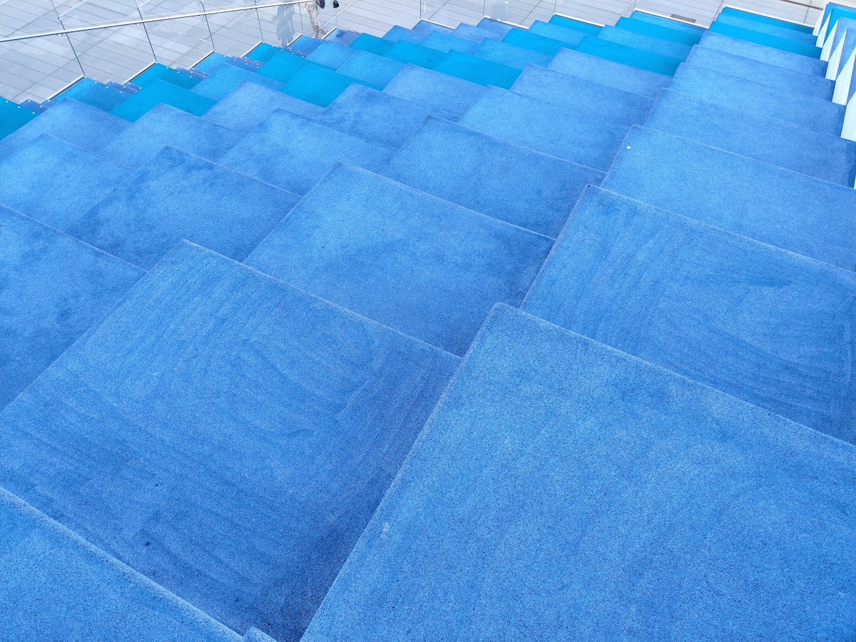 a person riding a skateboard down a set of stairs