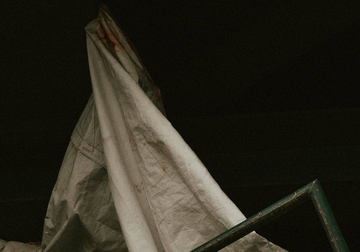 white textile on black surface