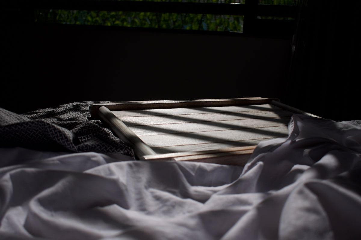 a person lying on a bed