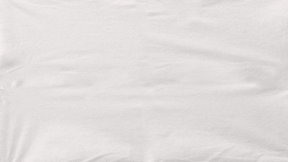 a close up of a white shirt on a white background