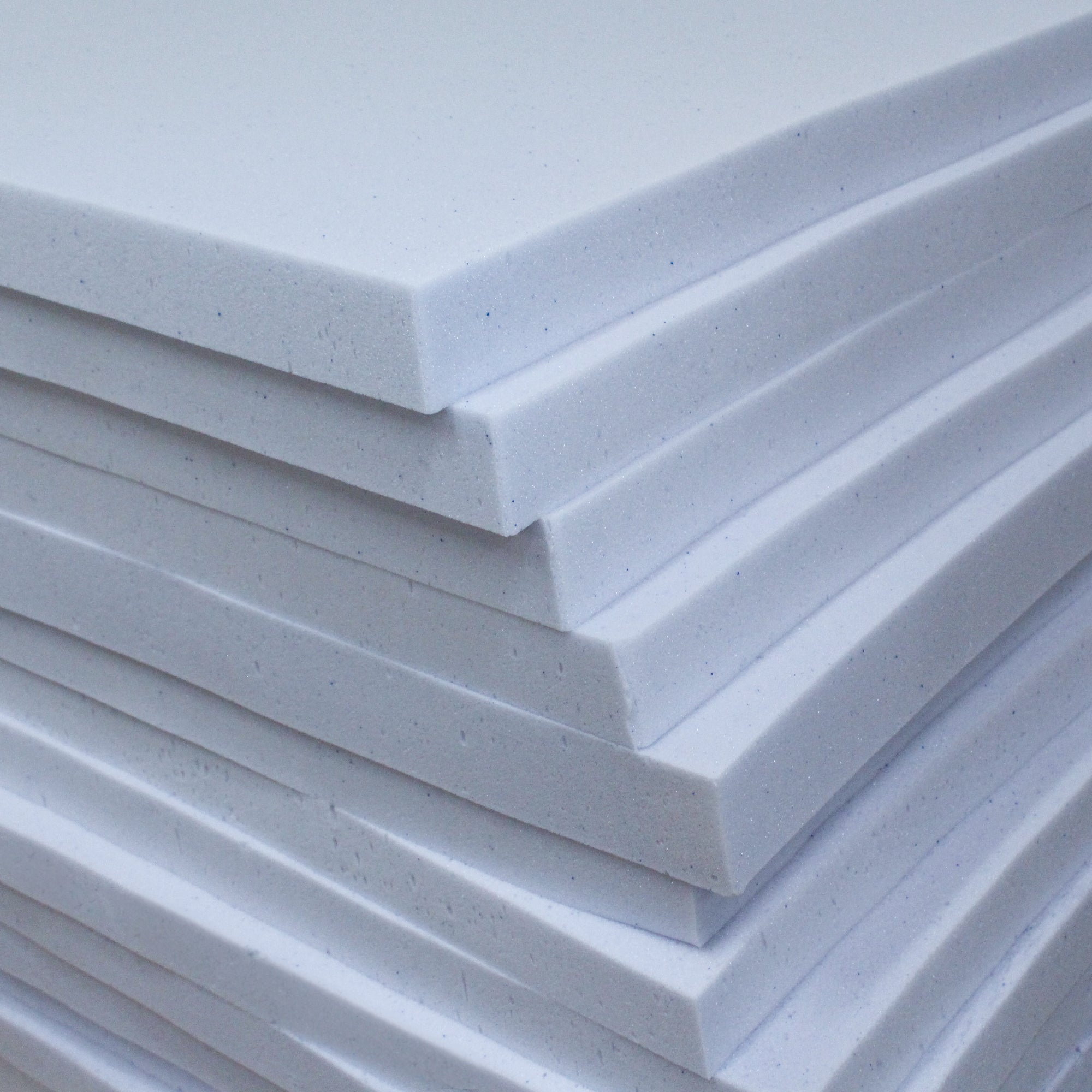 Stack of LOUNJ Gel Memory Foam Mattress Toppers